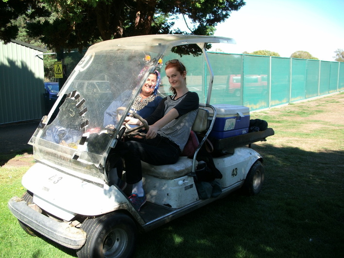 Lilian driving a golf cart at the Heat Pumps NOW Christchurch fundraiser.