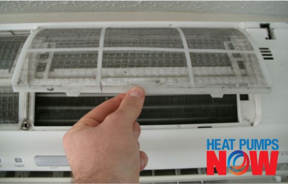 Lift up and pull out the heat pump's air filters for cleaning.