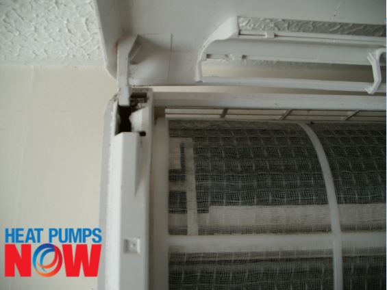 When you can see the heat pump's hinges for the front cover, gently pull it out towards you.